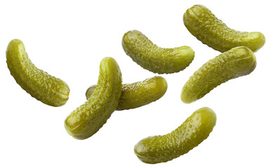 Falling delicious marinated pickled cucumbers, isolated on white background