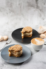 Banana or nut cake on gray plate on marble background. Selective focus. Vertical photo. Menu for bakery. cafe menu. Pastry. Delicious and sweet dessert at cafe restaurant.