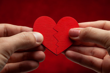 Two halves of one heart. A man and a woman connect a heart together. Couples in love