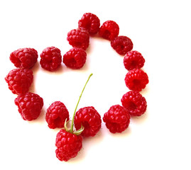 Ripe sweet raspberries isolated on white. Heart made of raspberry. Valentine's Day. copy space. free space for text
