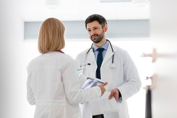 Doctors discussing medical results of patient in clinic