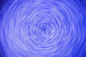 Fototapeta premium Abstract background. luminous swirling. Elegant glowing circle. Light ring. Sparking particle. Space tunnel. Colorful ellipse. Glint sphere. Bright border. Energy ball.