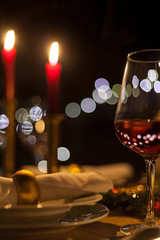 festive christmas table with candles and gold decoration cozy family meal