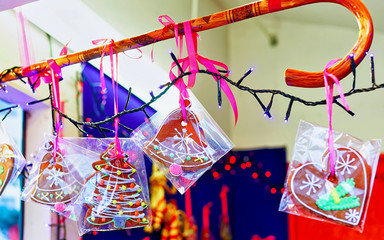 Brightly decorated gingerbreads hanging for sale at one of the stands during the Christmas market in old Riga, Latvia. Gingerbreads are the most traditional sweets during the Christmas period.