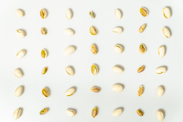 Pistachio nuts with shell and no shell isolated on white background