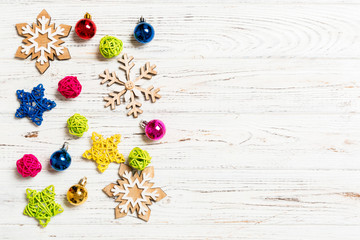 Top view of Christmas decorations and toys on wooden background. Copy space. Empty place for your design. New Year concept