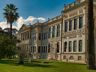 The beautiful and famous Dolmabahce Palace with a garden in front of the palace.