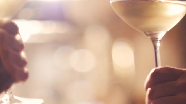Toasting with wine glasses during a celebration party. 