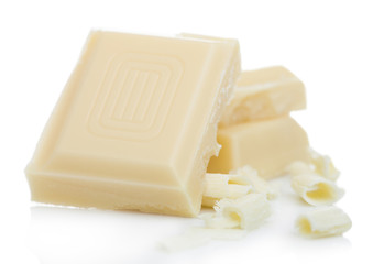 White chocolate pieces and curls isolated on white background