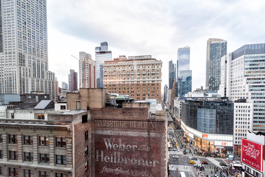 New York City, USA - April 6, 2018: Aerial view of urban cityscape, Empire State, skyline, rooftop building skyscrapers in NYC Herald Square Midtown with Macy's store, construction