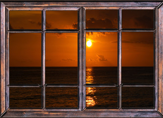 view from the open window of the caribbean sunset