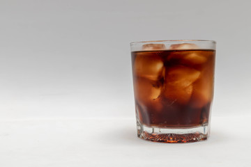 A close up in a glass of cold cola