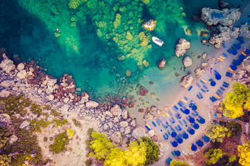 Fototapeta na wymiar top view from drone to shore with beach of Anthony Queen Bay, Greece Rhodes, popular tourist destination.