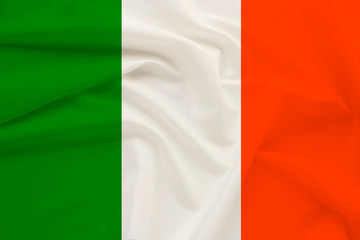 national flag of the country ireland on delicate silk with wind folds, travel concept, immigration, politics, copy space, close-up