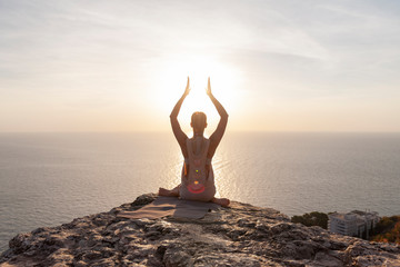 yoga meditation on the beach at sunset