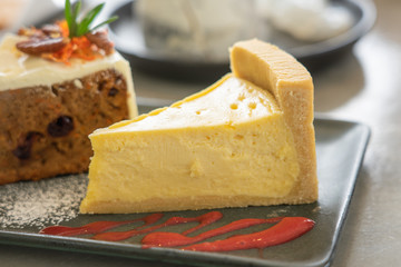 New York cheesecake on the plate, food background - dessert.