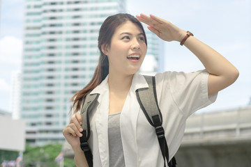 Fototapeta premium Traveler pretty blissful girl use smartphone check location while walking around the city