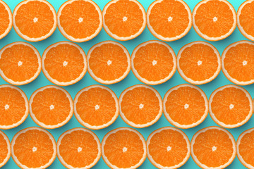 Colorful fruit pattern of fresh grapefruit slices on colored background. grapefruit slices top view.