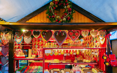 Gingerbread cookies at Christmas Market at Charlottenburg Palace in Winter Berlin, Germany. Advent Fair Decoration and Stalls with Crafts Items on the Bazaar.