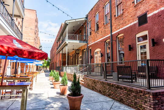 Montgomery, USA - April 21, 2018: Brick buildings restaurant on empty Alley street during day in capital Alabama city in downtown old town