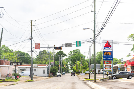 Montgomery, USA - April 21, 2018: Road street during day in capital Alabama city, cars in traffic, Citgo gas station, light