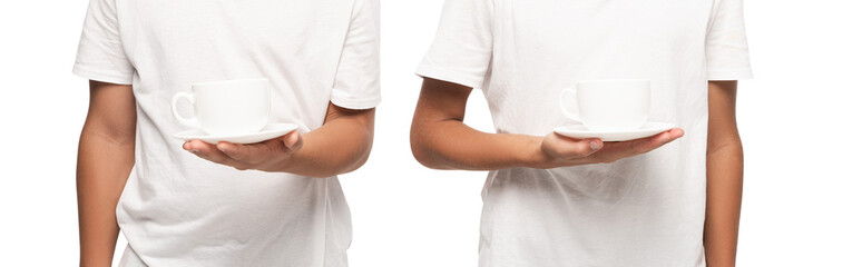 cropped view of two boys holding saucers with cups of coffee isolated on white, panoramic shot