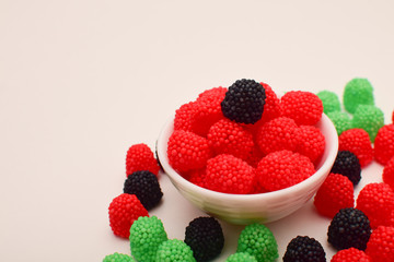 raspberry shaped candies scattered on the table