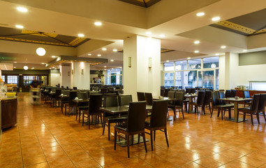 large empty dining room of all inclusive resort restaurant, Europe, Greece.