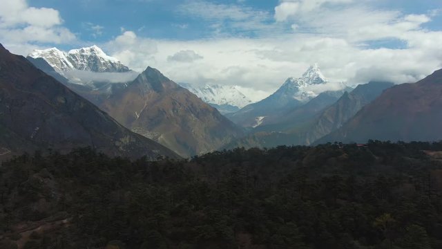 Ama Dablam and Taboche Mountains. Khumbu Valley. Himalaya, Nepal. Aerial View. Drone Flies Backwards