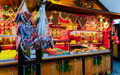 Gingerbread cookies in Christmas market, Germany Europe in winter. German Night street Xmas and holiday fair in European city or town, December. Gendarmenmarkt in Berlin - obrazy, fototapety, plakaty