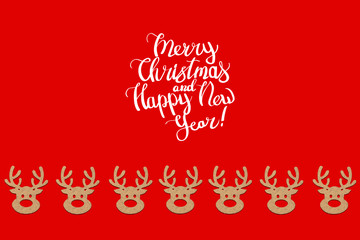 Wooden Christmas toys head of a deer is lined with a pattern on a red background. Add text Merry Christmas and Happy New Year. Minimalistic style. Flat lay, top view