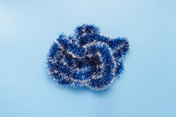 Christmas decoration on a blue background. Minimalism. Concept of the New Year and Christmas. Flat lay, top view