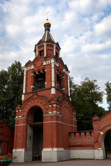 Fototapeta na wymiar Gate bell tower in Lukino