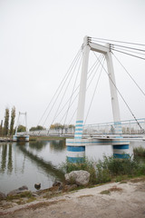 Azov City. Rostov region. Russia. View of the bridge on river Don. Cloudy and foggy day in autumn, 2019