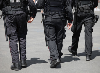three cops patroling the road