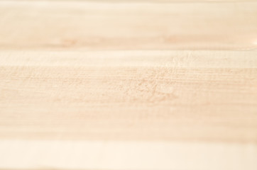 close up of rowan light brown wood profile surface selective focus blur background
