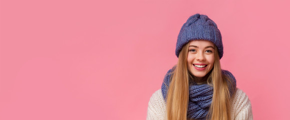 Portrait of smiling girl in winter hat with free space