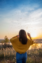 girl looks at the purple sunset