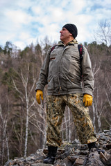 Portrait of a traveler climbing a mountain