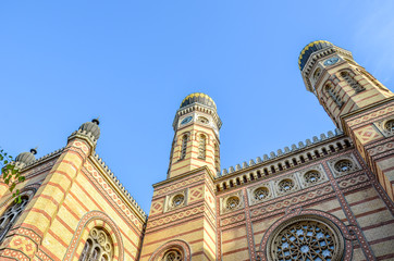 Facade of the Great Synagogue in Budapest, Hungary. Known also as Dohany Street Synagogue, the largest synagogue in Europe. Centre of Neolog Judaism. Facade and two onion domes. Tourist attraction