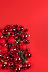 Christmas composition. Christmas red decorations on red background. Flat lay. Christmas and happy new year concept for Christmas promotion banner