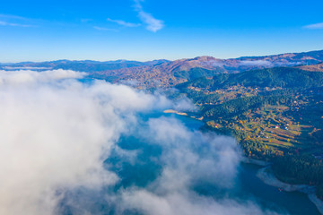 Fototapeta premium Autumn fog cloud in mountain landscape