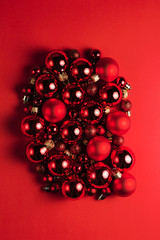 Christmas composition. Christmas red decorations on red background. Flat lay. Christmas and happy new year concept for Christmas promotion banner