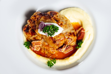 Stuffed cabbage rolls with rice and meat in tomato sauce.