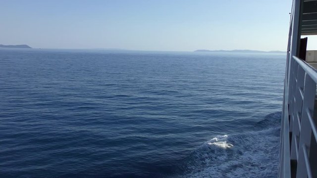 View from the side of the sea ferry going along the Ionian Sea towards the island of Corfu. Greece.