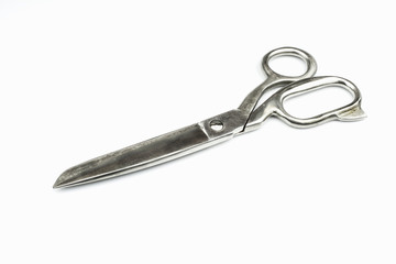 Obraz premium Old stainless metal scissors isolated on a white background.