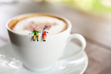 Miniature people : Coffee cup with businessman , image use for charge your energy in the morning