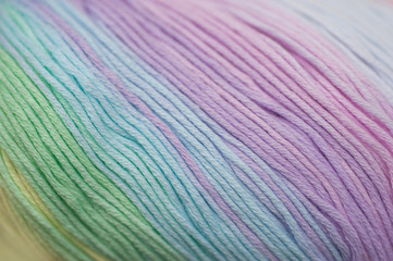 Abstract of skein of mixed pastel colored acrylic threads