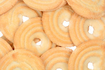 Delicious biscuit rings on a white background