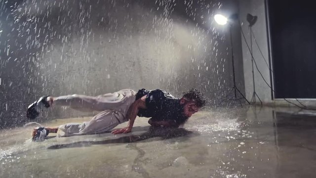 Dancer in motion in aqua studio